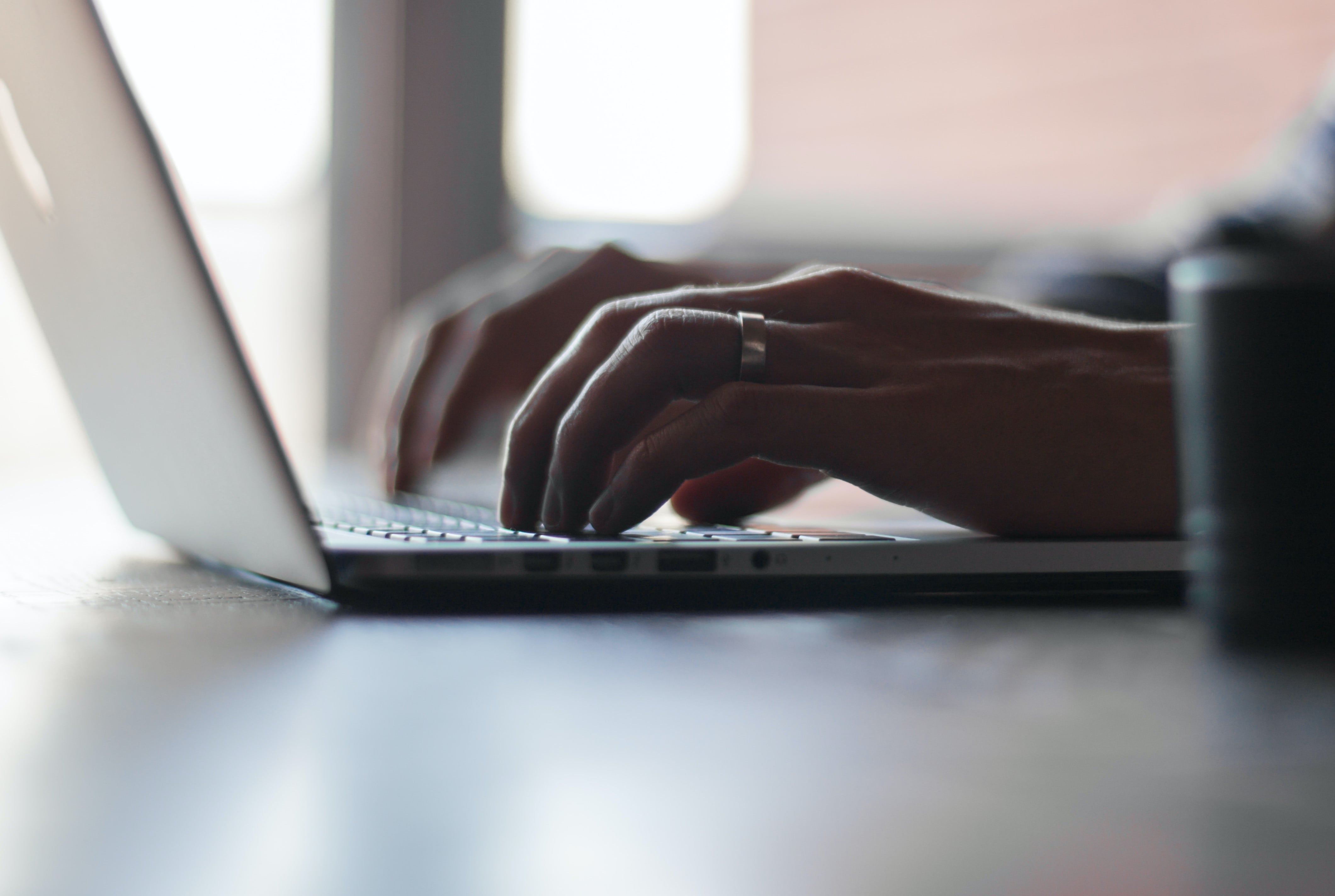 A businesswoman checks over her schedule on her companies digital workflow tool.